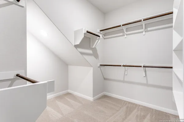 a view of an empty walk in closet