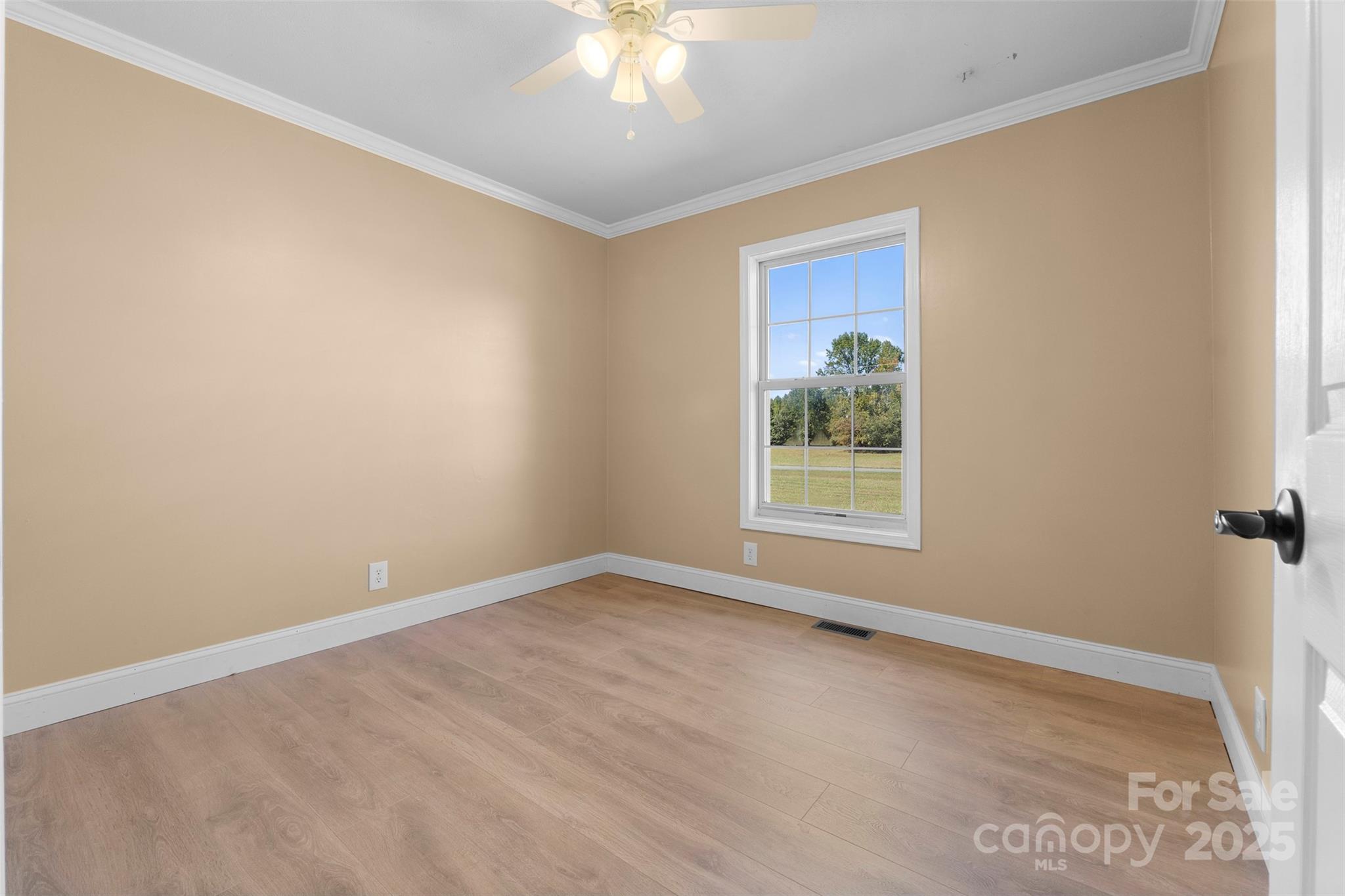 225 Lm Overcash Road Salisbury, NC 28146 - Photo 14 of 26 a view of a big room with windows and chandelier fan