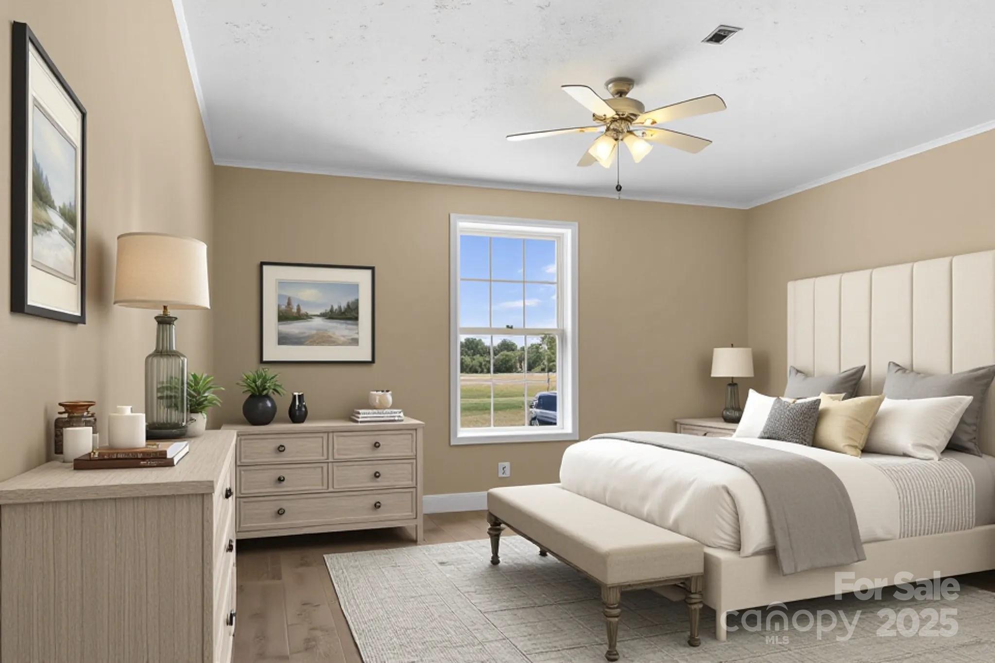 225 Lm Overcash Road Salisbury, NC 28146 - Photo 17 of 26 a bedroom with a bed and a chandelier