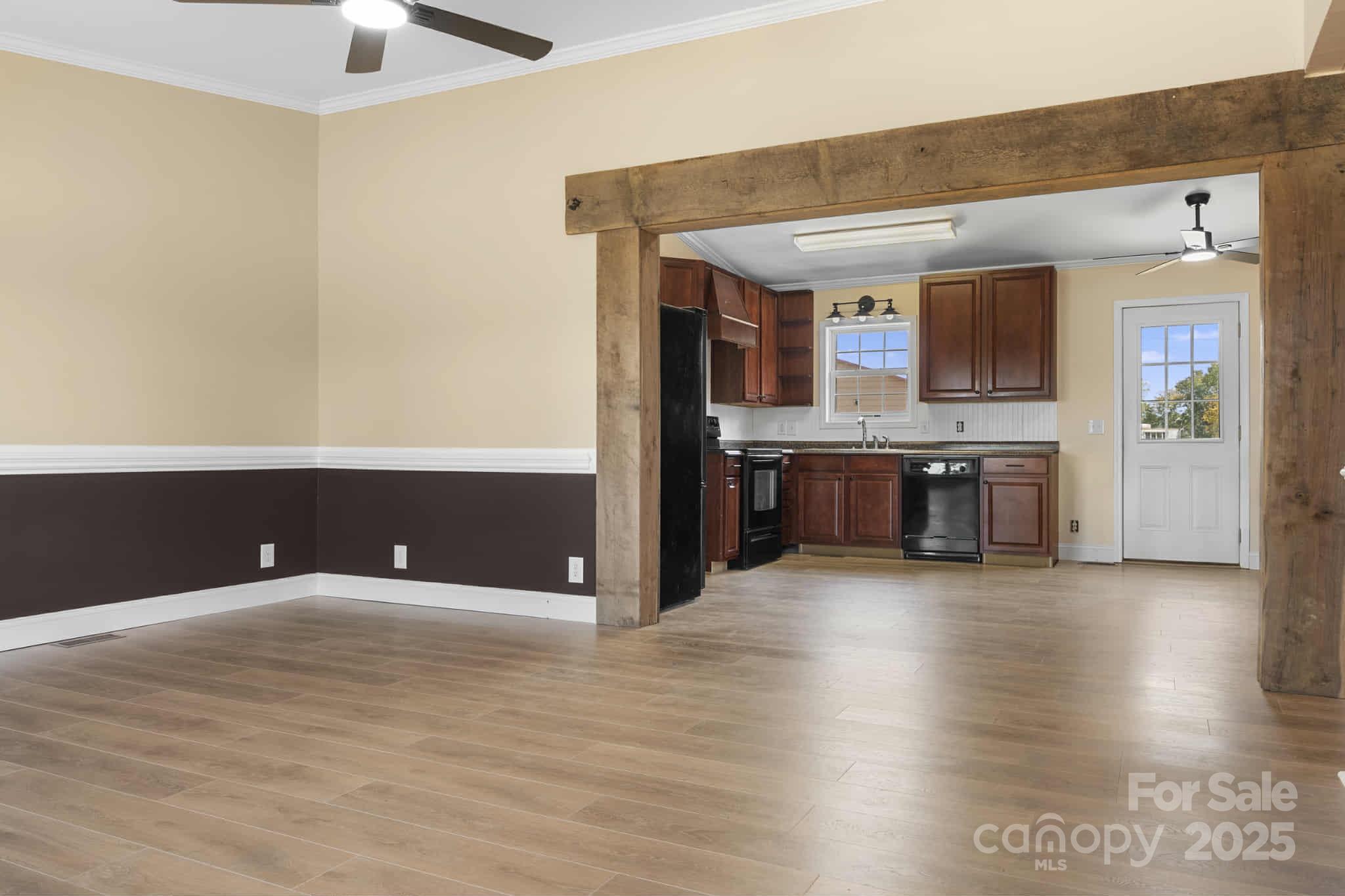 225 Lm Overcash Road Salisbury, NC 28146 - Photo 5 of 26 an empty room with wooden floor and windows