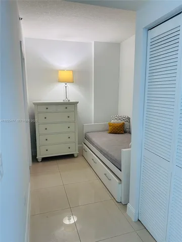 a bedroom with a bed and a cabinets