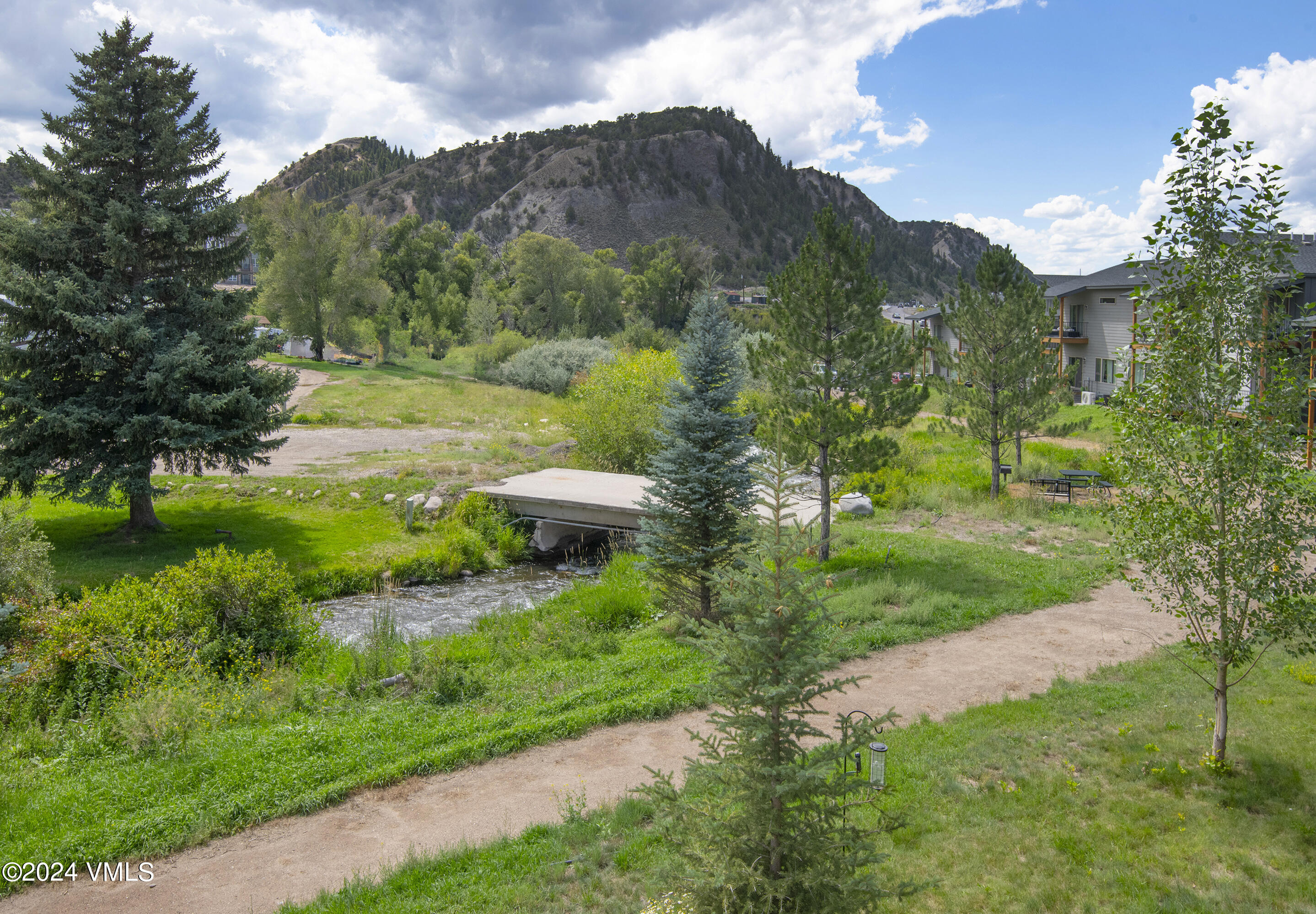 36 Eagle Landing Way Eagle, CO 81631 - Photo 36 of 36 a view of a lush green hillside and a building