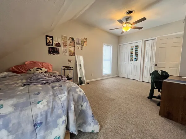 a view of a livingroom with furniture and a chandelier