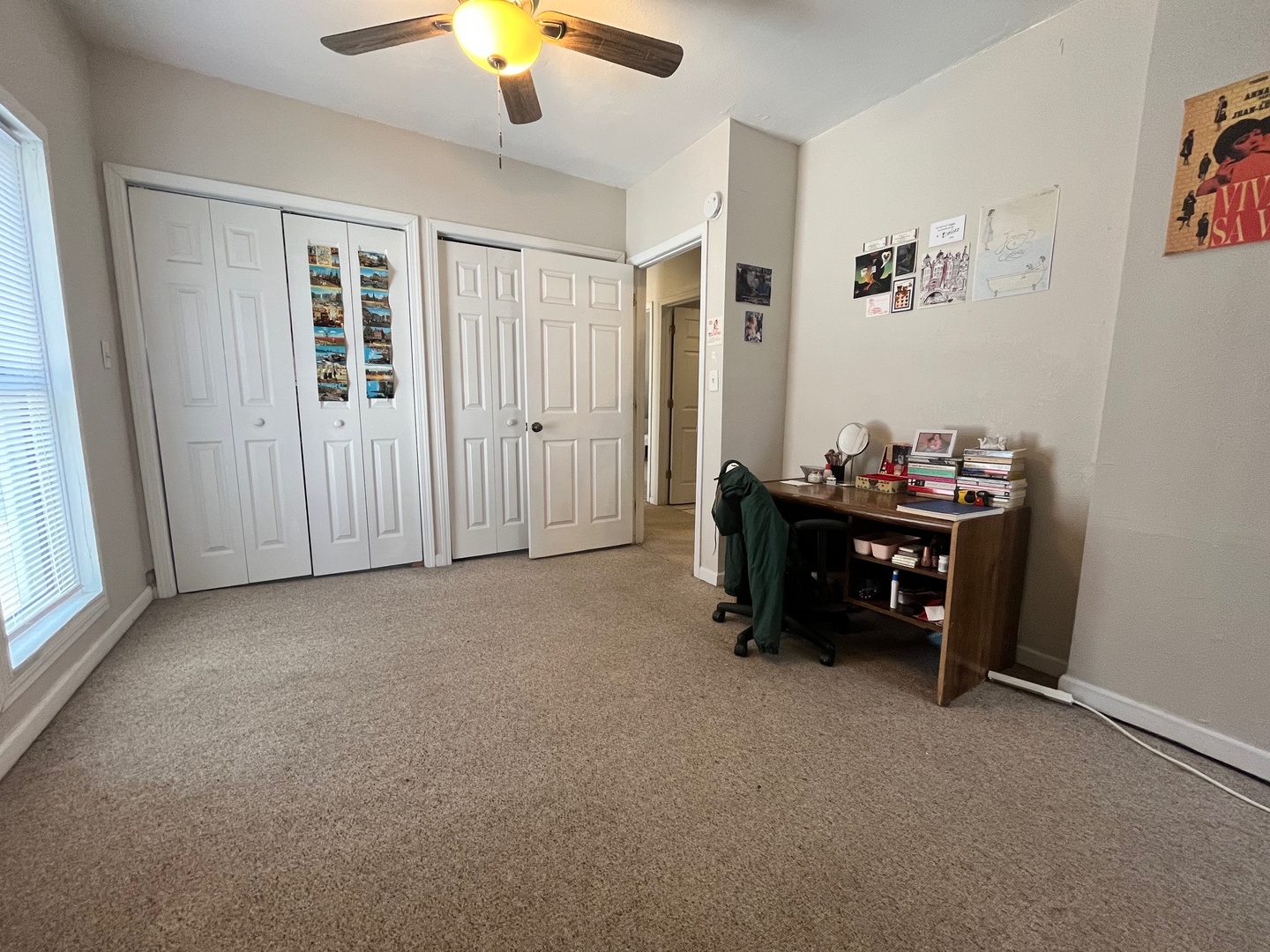 706 West High Street Urbana, IL 61801 - Photo 13 of 21 a room that has a bed and a chandelier in it