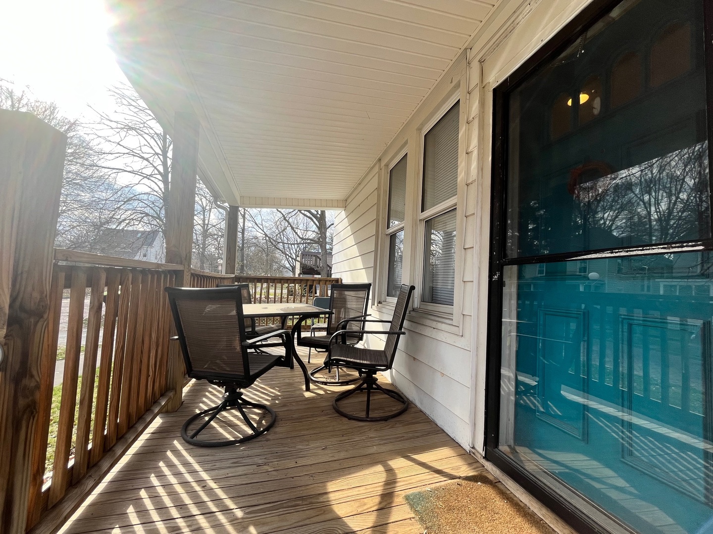706 West High Street Urbana, IL 61801 - Photo 2 of 21 a view of a balcony with chairs and wooden floor