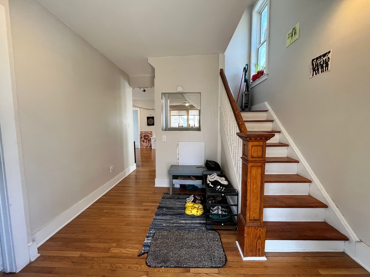 706 West High Street Urbana, IL 61801 - Photo 3 of 21 a room with wooden floor and stairs