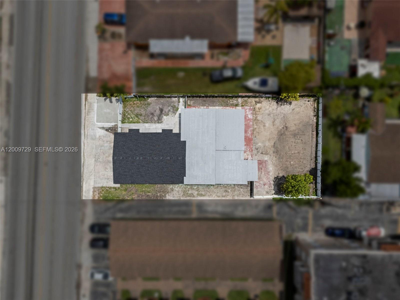 1370 West 29th Street, Unit B Hialeah, FL 33012 - Photo 4 of 15 an aerial view of a house with a yard