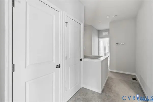 a view of a hallway with closet area