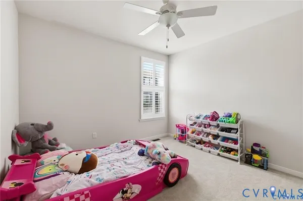 a view of walk in closet with clothes