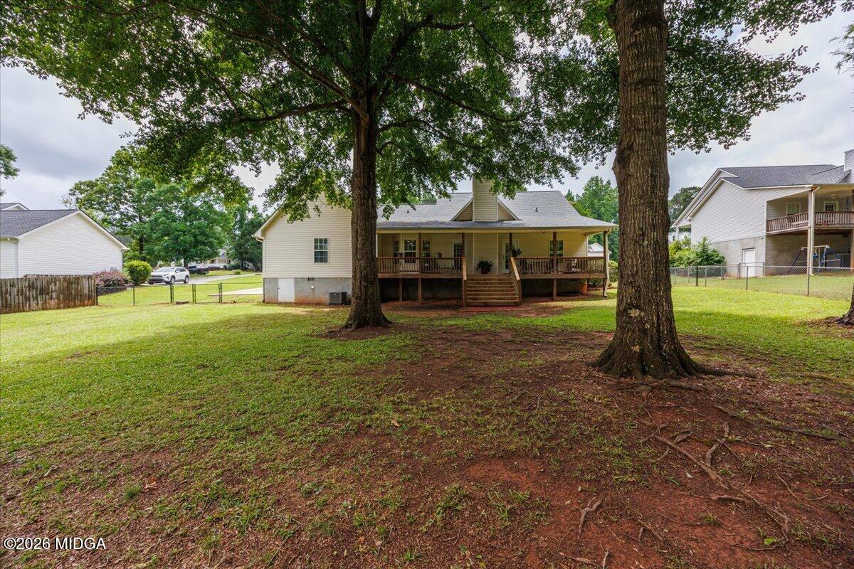 557 Aarons Circle Gray, GA 31032 - Photo 33 of 36 a front view of a house with garden