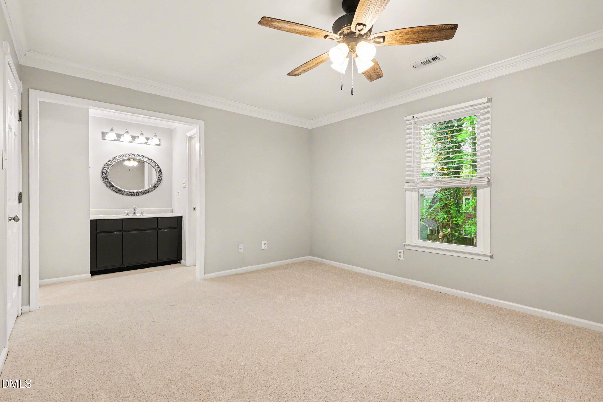 5645 Hamstead Crossing Raleigh, NC 27612 - Photo 20 of 35 an empty room with windows and fan