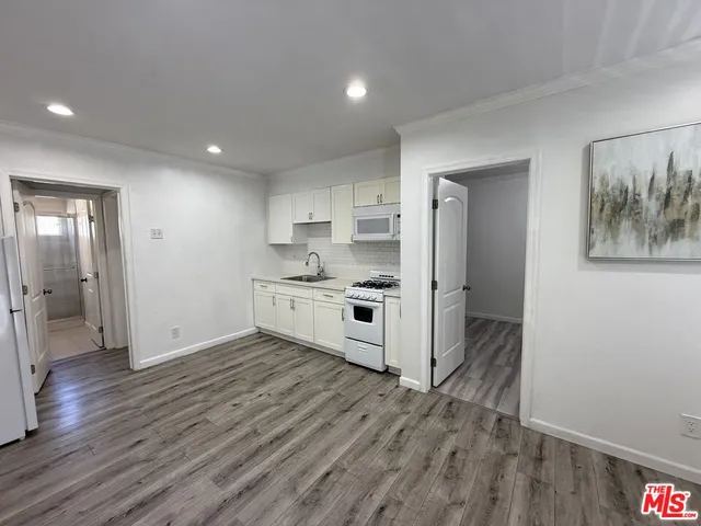 a view of kitchen with wooden floor