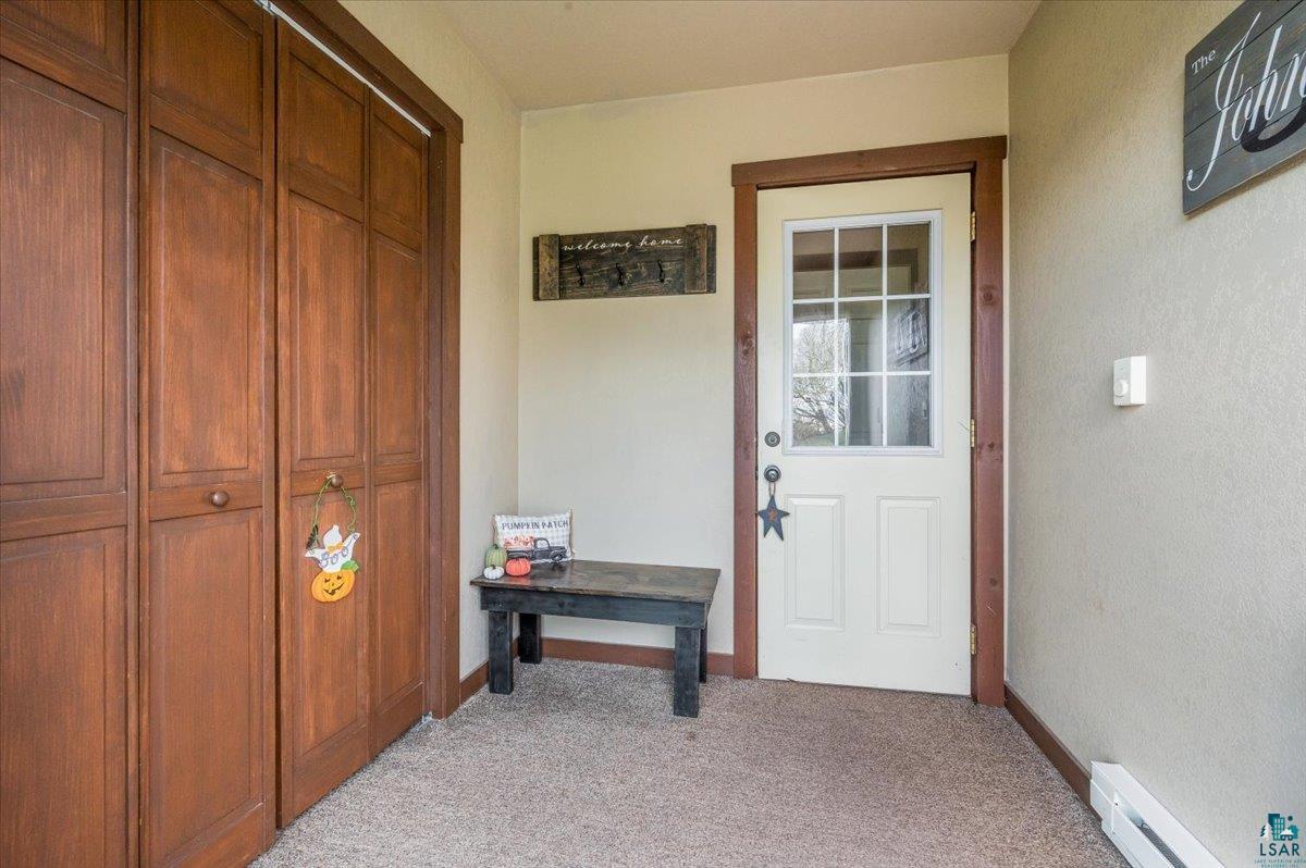 7702 East Rockmont Road Poplar, WI 54864 - Photo 5 of 22 Interior space featuring a baseboard heating unit