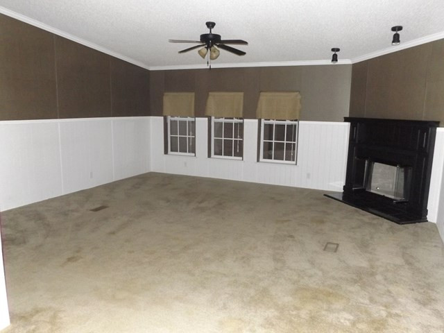 504 White Pond Road Williston, SC 29853 - Photo 2 of 15 a view of an empty room with a fireplace