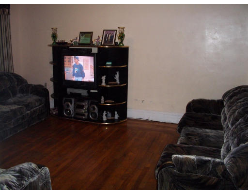 20 Chatham Road Everett, MA 02149 - Photo 2 of 4 a living room with furniture and a flat screen tv