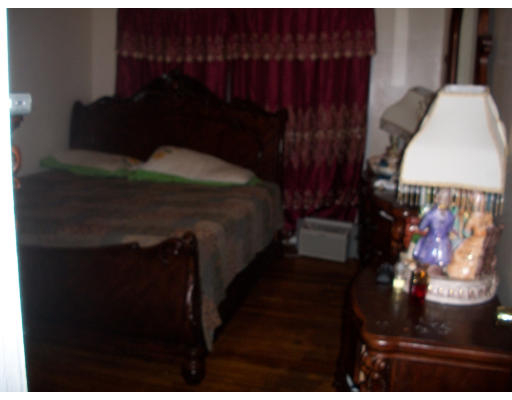 20 Chatham Road Everett, MA 02149 - Photo 3 of 4 a bedroom with a bed and a window