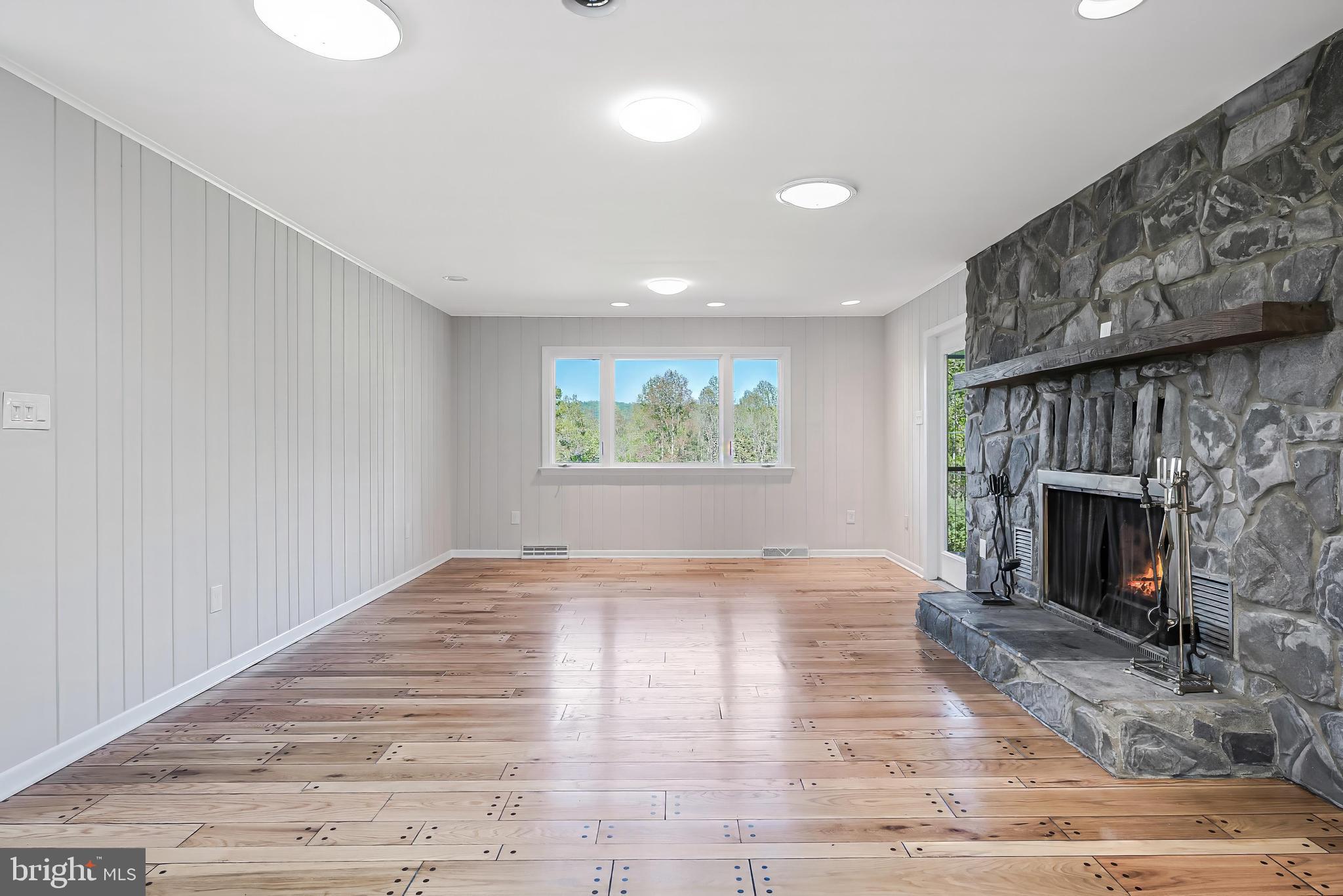 6891 Wilson Road Marshall, VA 20115 - Photo 58 of 118 Spacious living area with stone fireplace.