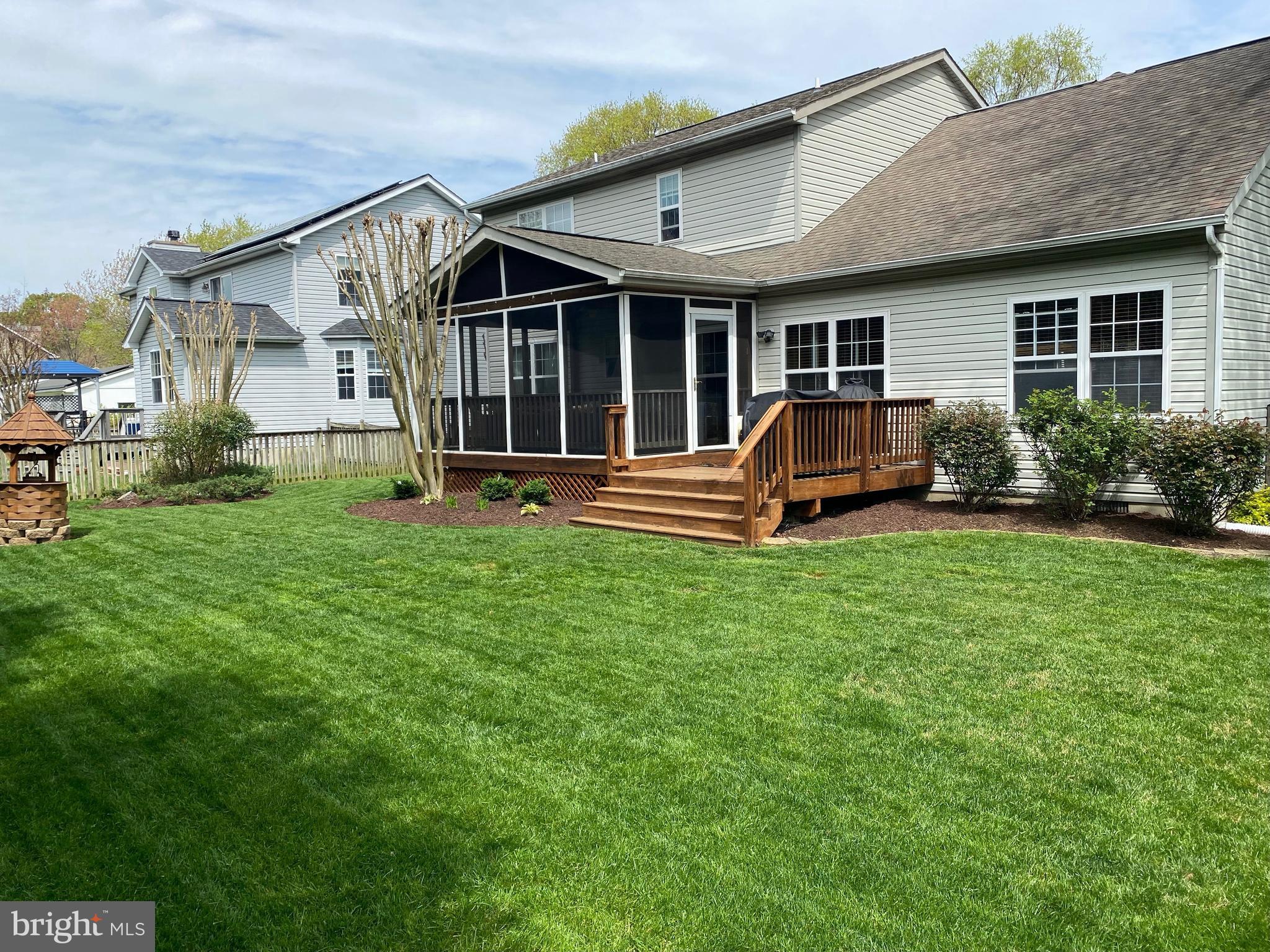 1545 Wakefield Road Edgewater, MD 21037 - Photo 8 of 9 a front view of a house with a yard and yard