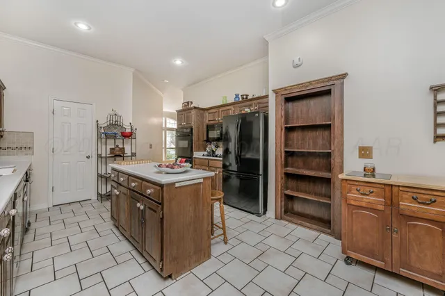 a kitchen with a stove and a refrigerator