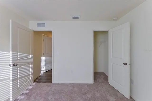 a large kitchen with a stove top oven a sink and a refrigerator