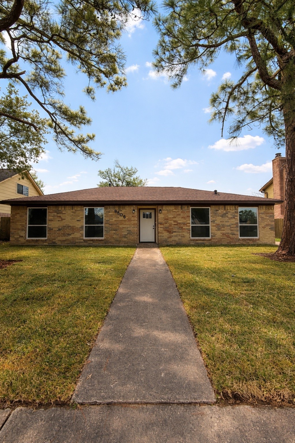 9806 Early Spring Drive Houston, TX 77064 - Photo 14 of 14 a front view of a house with a yard