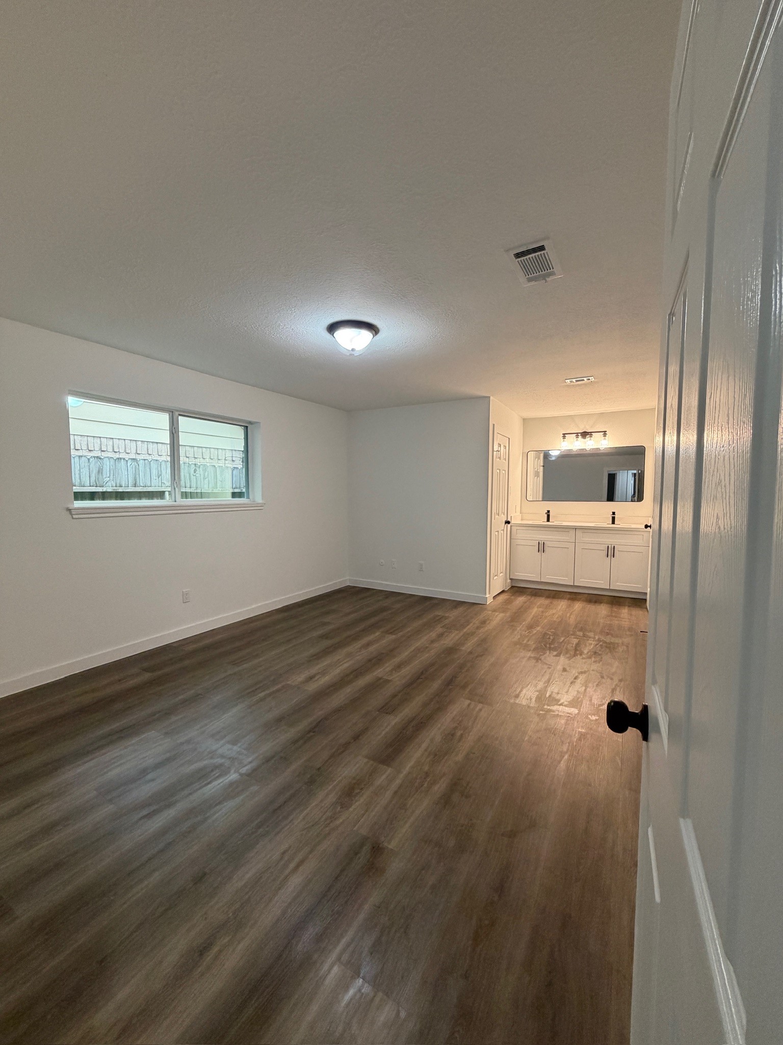 9806 Early Spring Drive Houston, TX 77064 - Photo 7 of 14 a view of a hallway with wooden floor