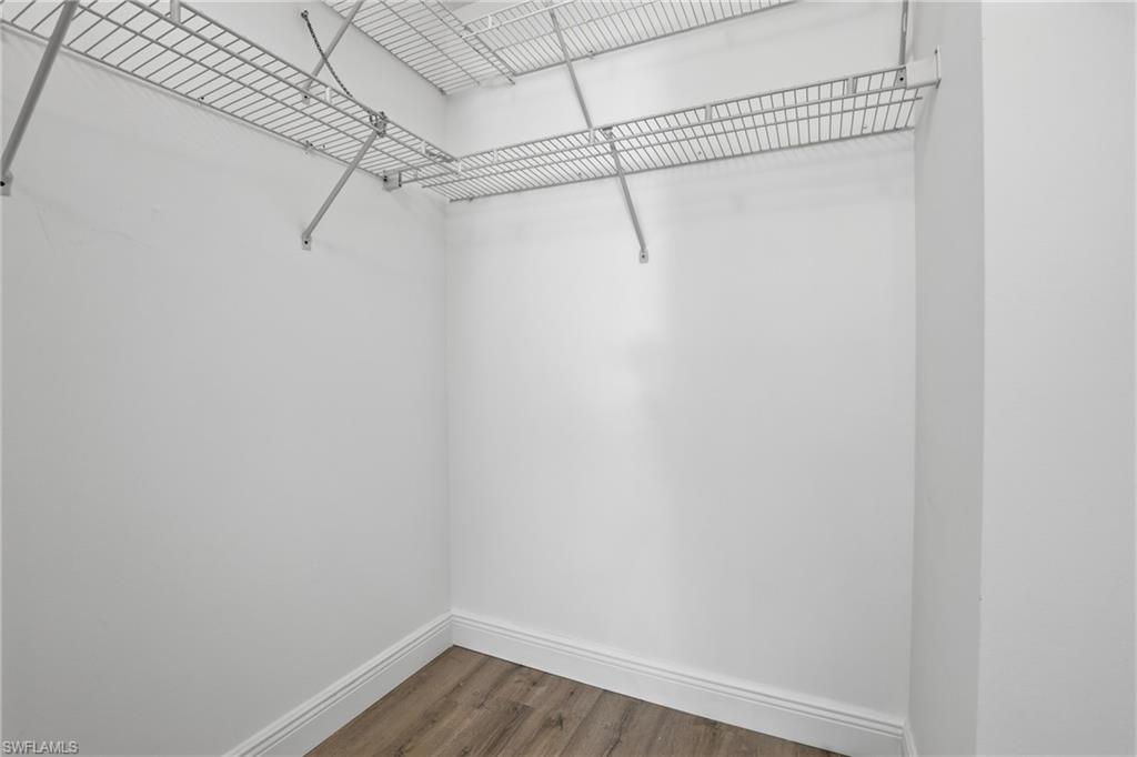 7762 Jewel Lane, Unit 201 Naples, FL 34109 - Photo 22 of 39 a view of a room with racks on the wall