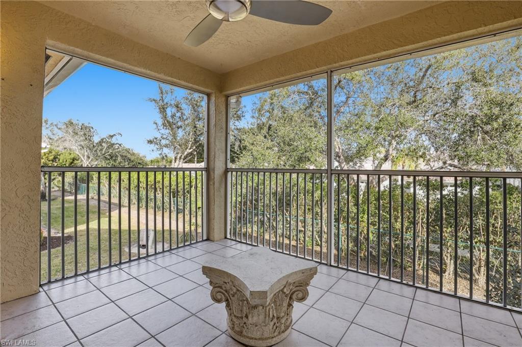 7762 Jewel Lane, Unit 201 Naples, FL 34109 - Photo 29 of 39 a room with sliding door and mountain view