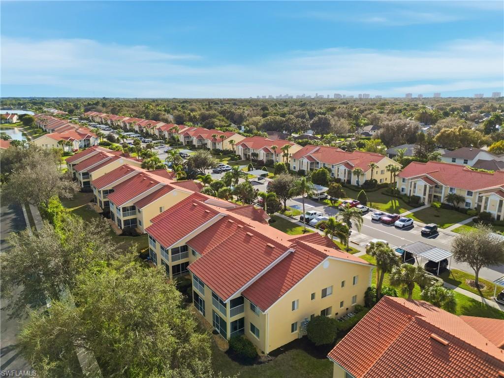 7762 Jewel Lane, Unit 201 Naples, FL 34109 - Photo 35 of 39 an aerial view of residential houses with city view