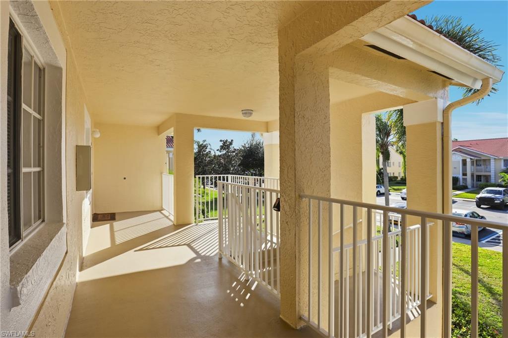 7762 Jewel Lane, Unit 201 Naples, FL 34109 - Photo 5 of 39 a view of a balcony with wooden floor