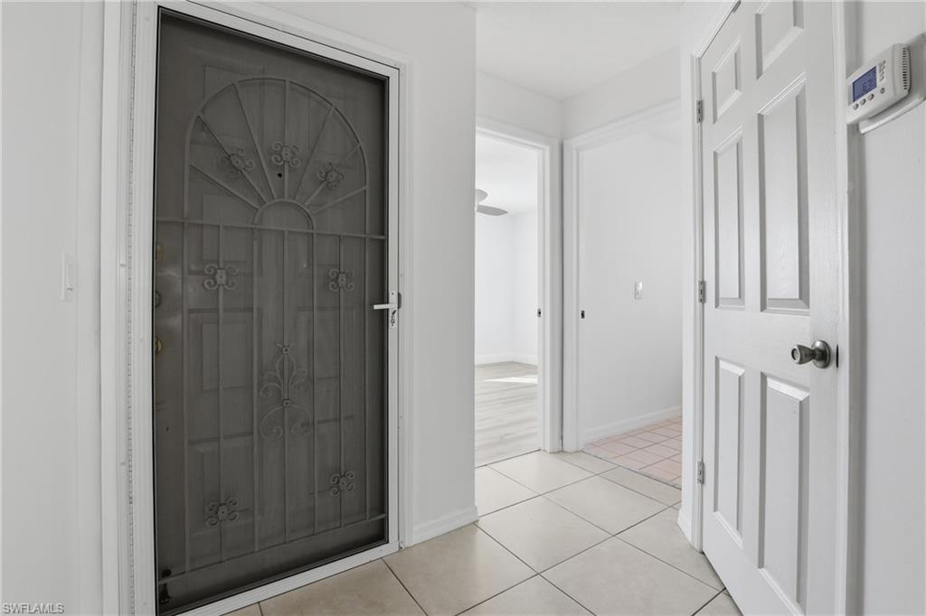 7762 Jewel Lane, Unit 201 Naples, FL 34109 - Photo 7 of 39 a view of a hallway