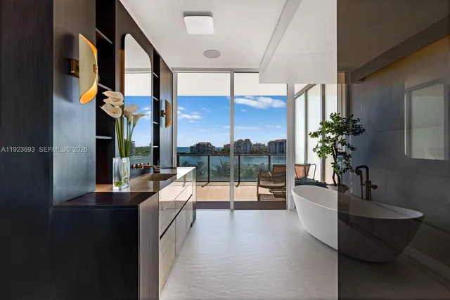 a lobby with furniture and potted plant