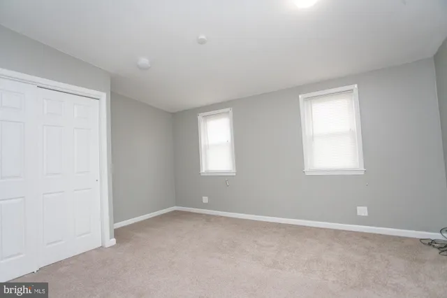 a view of an empty room and closet