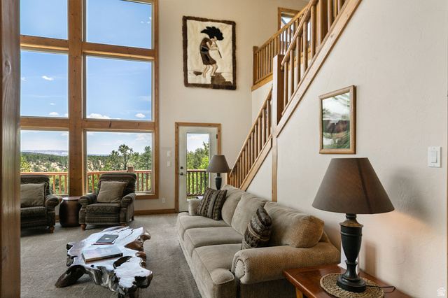755 South Zion Ridge Drive Orderville, UT 84758 - Photo 40 of 84 Living area featuring a high ceiling and carpet floors