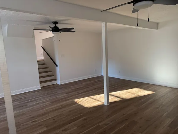a view of a big room with wooden floor