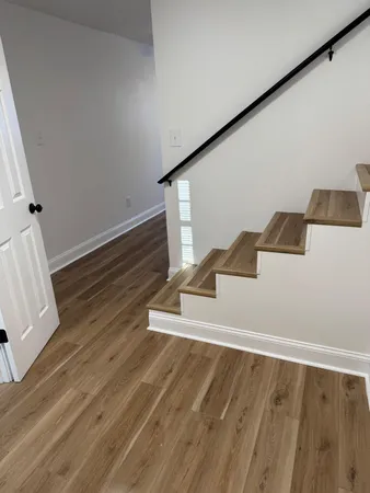 a view of wooden floor in an empty room