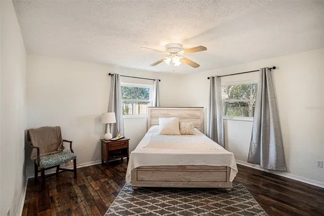 a bedroom with a bed furniture and a window