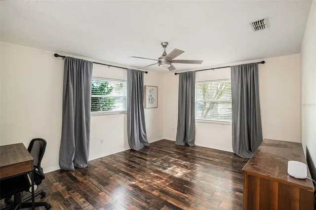 a bedroom with furniture and a window