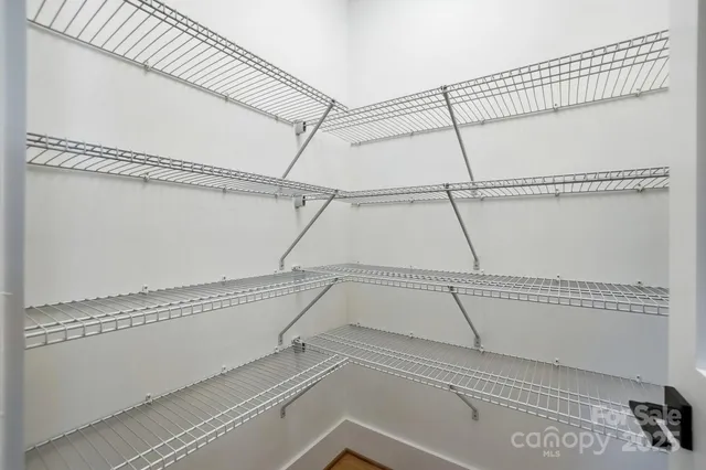 a view of a room with racks on the wall