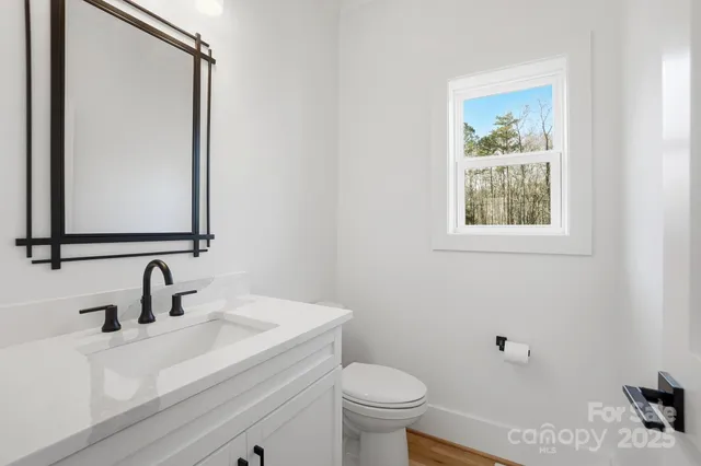 a view of staircase with white walls and a window
