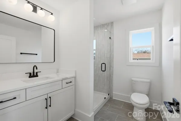 a view of a house with a yard and plants