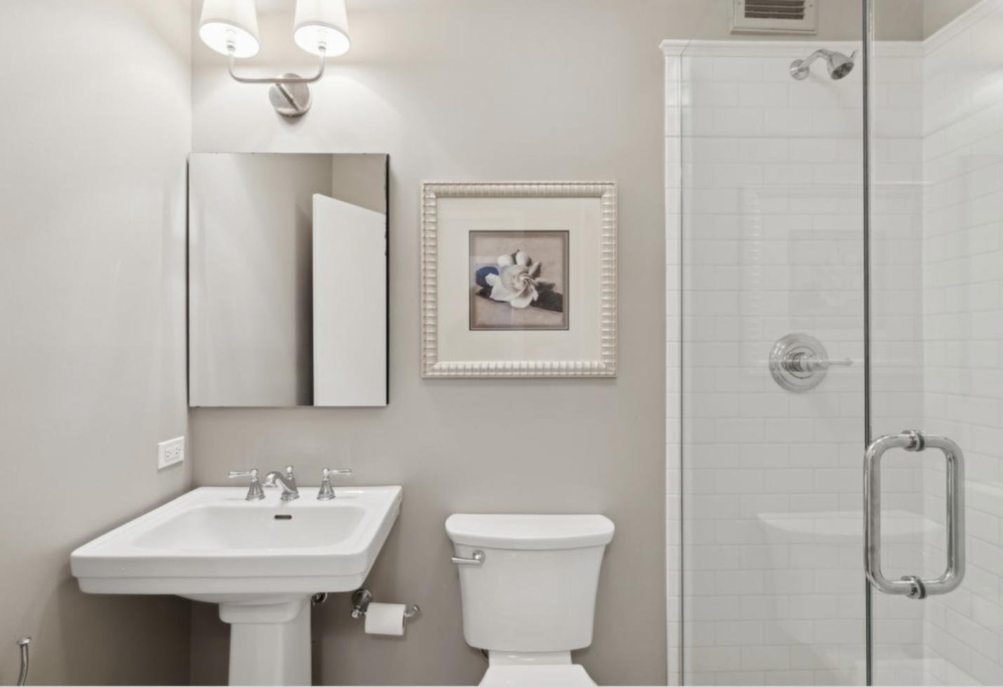 1440 Sheridan Road, Unit 501 Wilmette, IL 60091 - Photo 12 of 20 a bathroom with a sink toilet and mirror