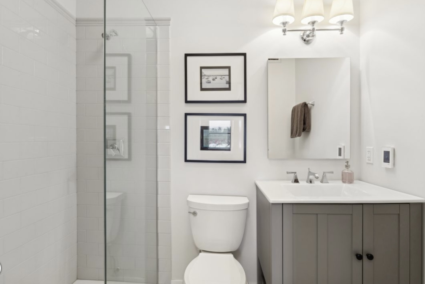 1440 Sheridan Road, Unit 501 Wilmette, IL 60091 - Photo 10 of 20 a bathroom with a toilet sink and mirror