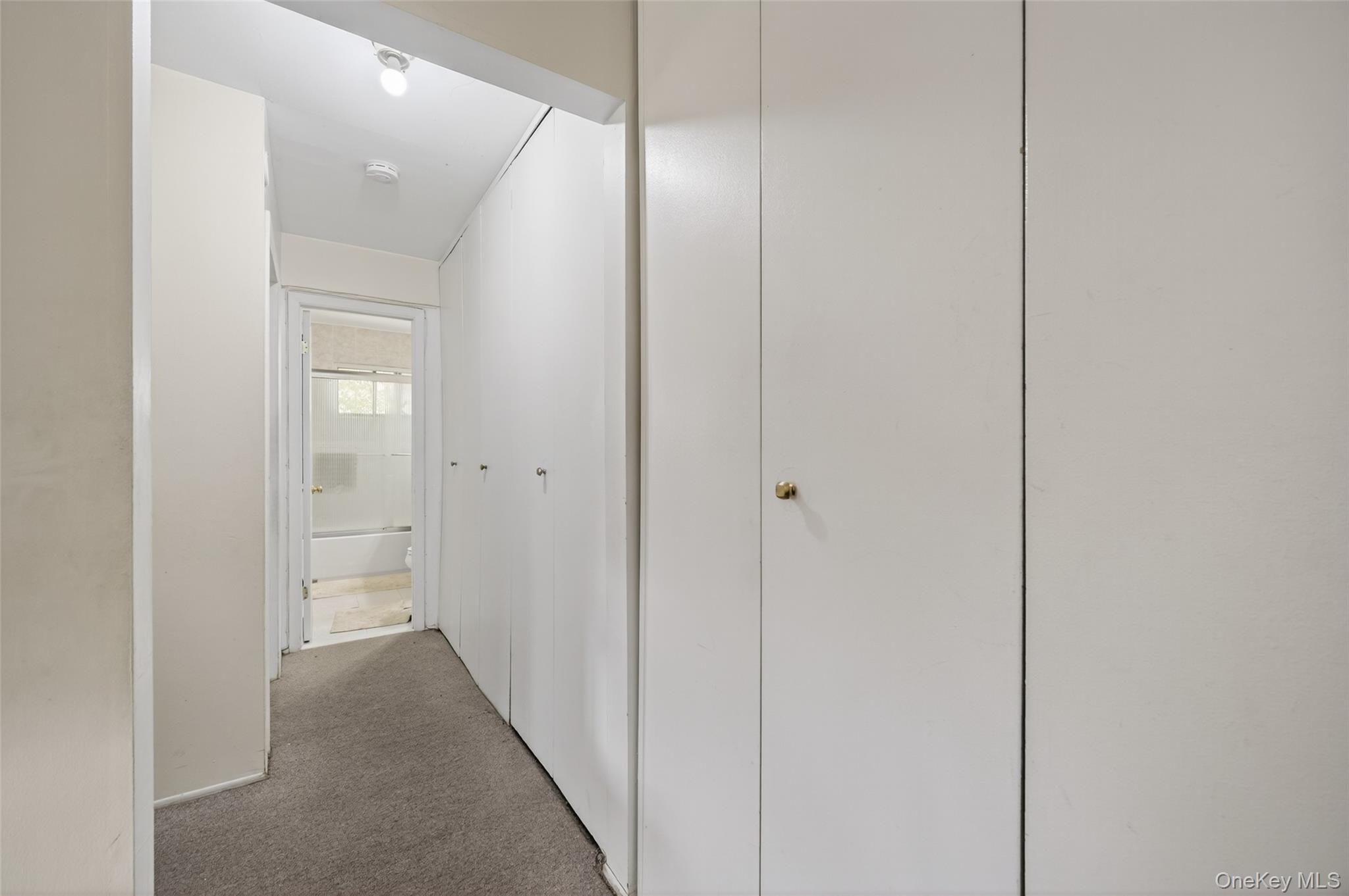 4 Secora, Unit E2 Monsey, NY 10952 - Photo 11 of 24 a view of a hallway with wooden floor