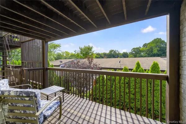a view of balcony with furniture