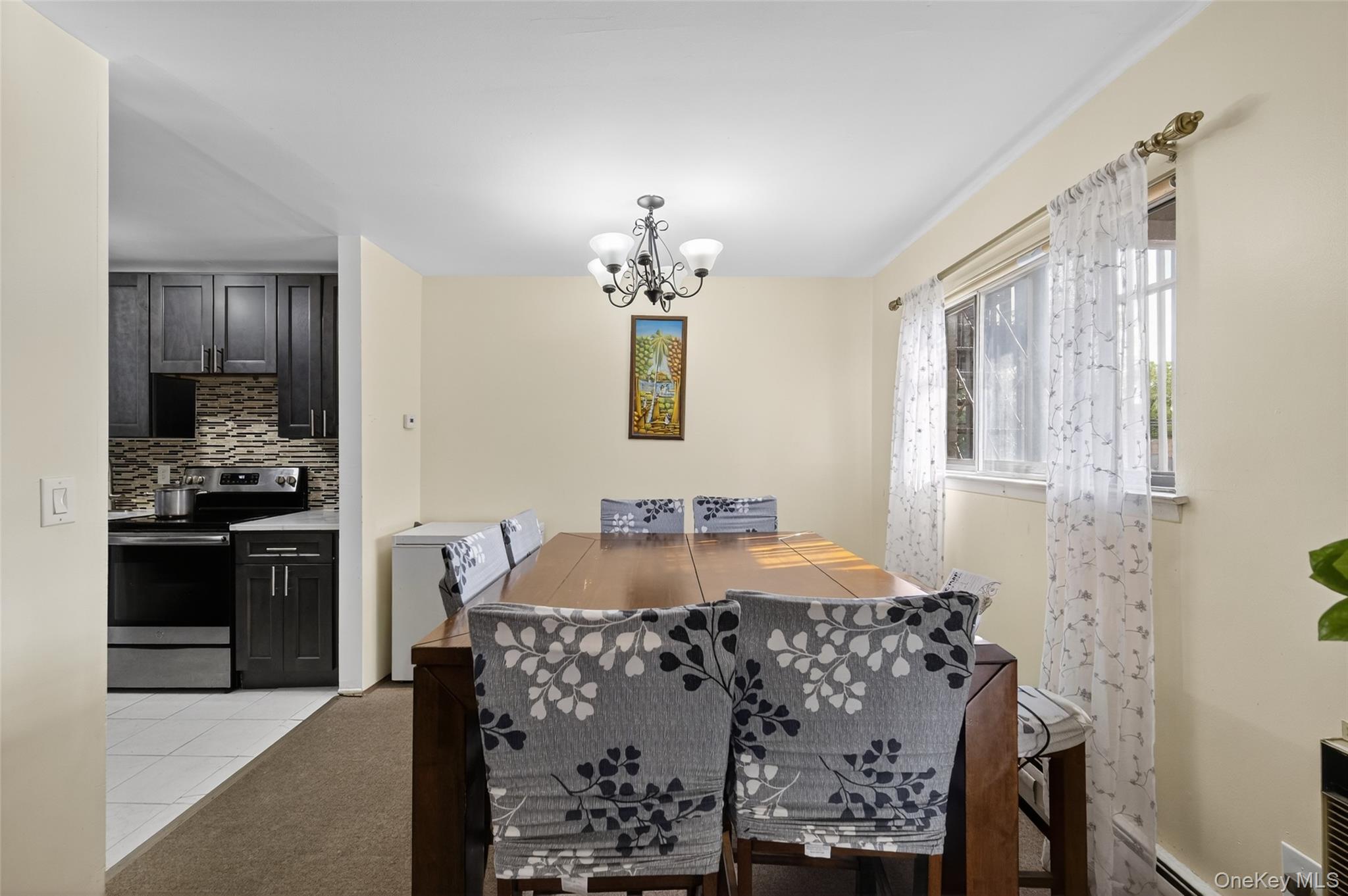 4 Secora, Unit E2 Monsey, NY 10952 - Photo 5 of 24 a bed room with a bed mirror and a dresser