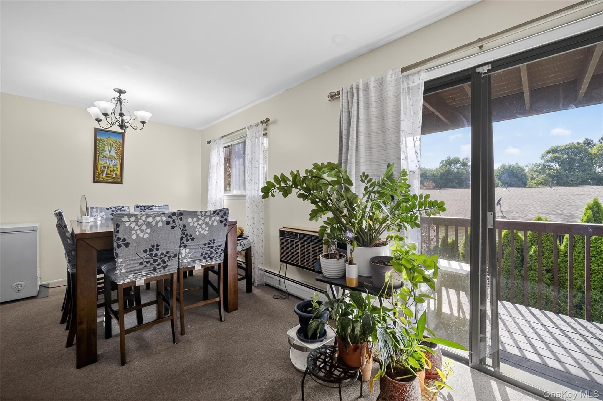 4 Secora, Unit E2 Monsey, NY 10952 - Photo 9 of 24 a view of a dining room with furniture window and wooden floor