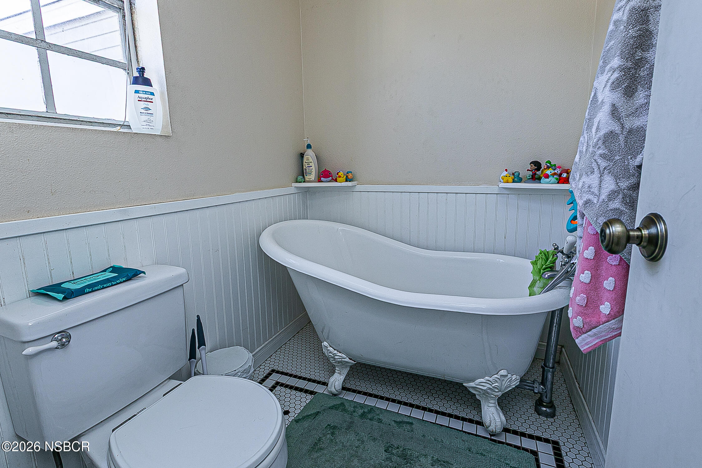 712 Pebble Beach Place Santa Maria, CA 93454 - Photo 26 of 31 a white bath tub sitting next to a white toilet and sink