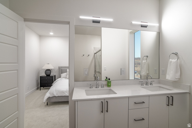 2768 Becco Trail, Unit 63 St. George, UT 84770 - Photo 19 of 27 Ensuite bathroom with double vanity, light carpet, a stall shower, and recessed lighting