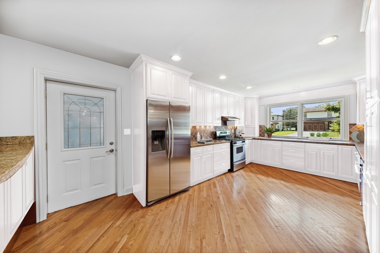 3080 Koepke Road Northbrook, IL 60062 - Photo 11 of 66 a view of kitchen with refrigerator and wooden floor